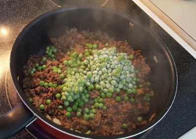 Adding frozen peas to cottage pie