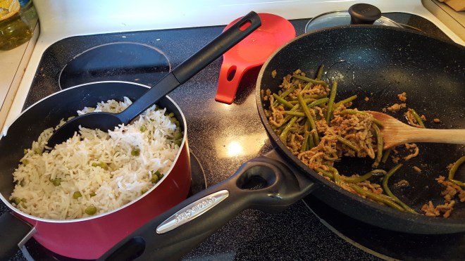 Rice and stir fry on the stove
