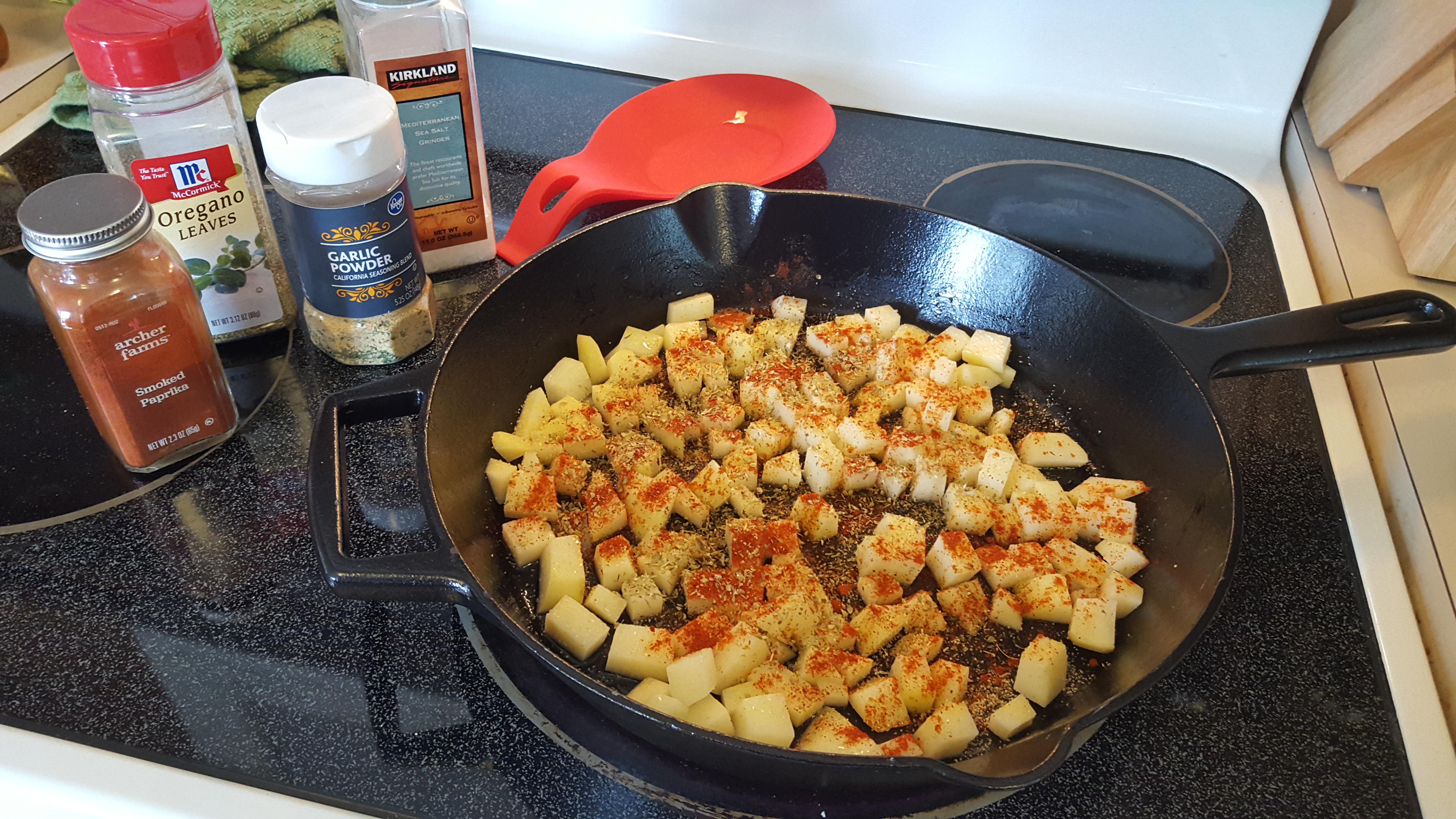 spices and potatoes in the frying pan