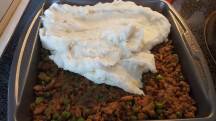 Spreading potatoes on porky pie.jpg