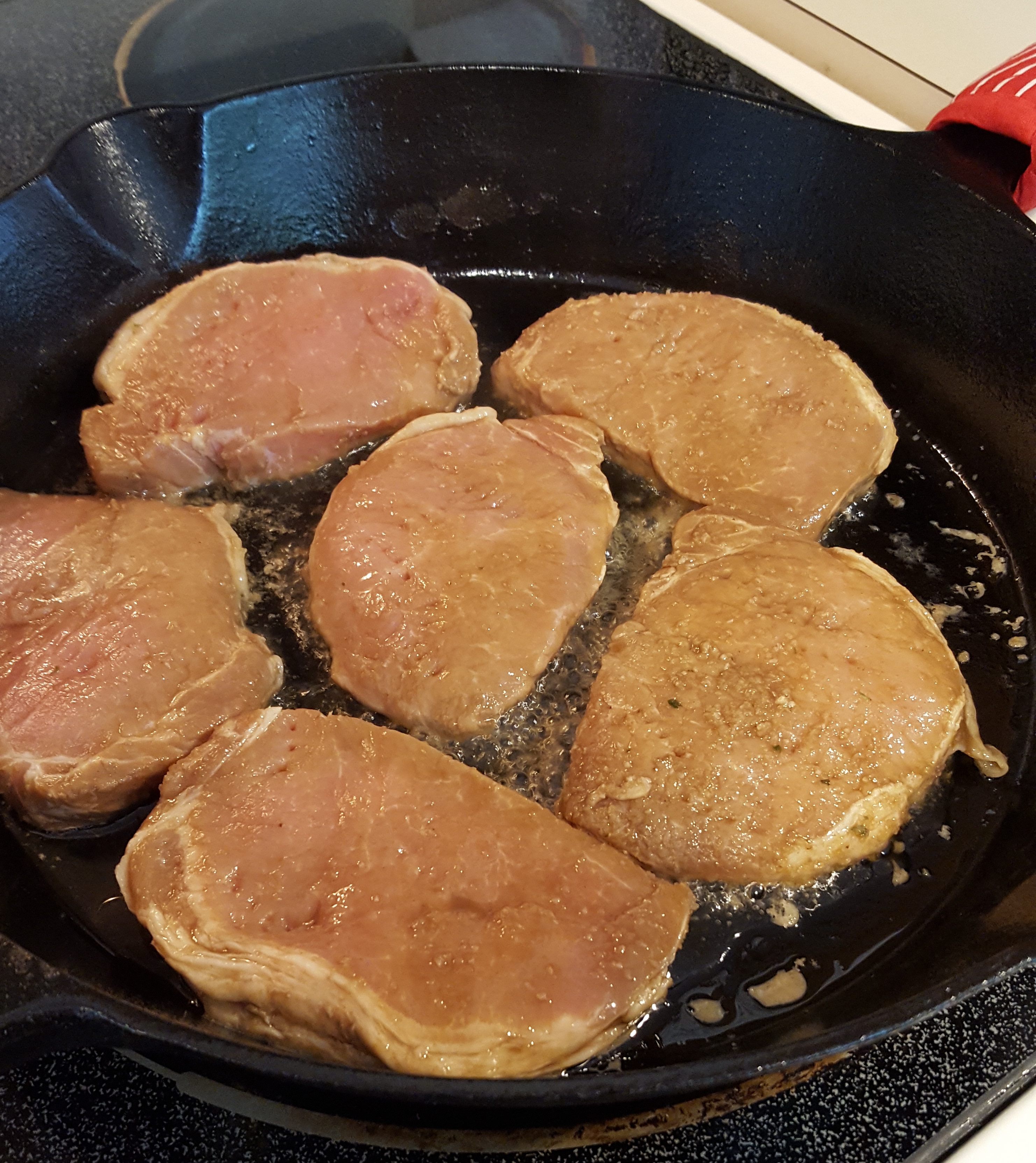 Pork steaks browning